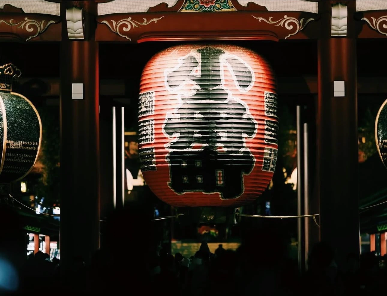 Beneath a great red lantern